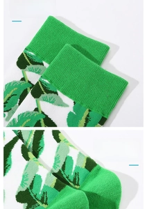 Detail of elastic cuff and non-slip heel on cotton socks with green leaf pattern