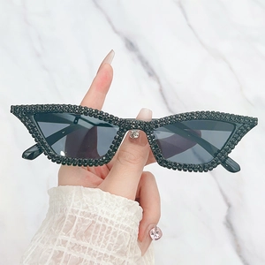 Classic black cat-eye sunglasses featuring handmade diamond rhinestones on a plastic frame