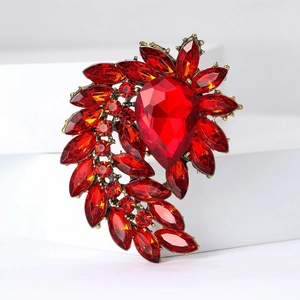 Vintage red rhinestone brooch with pear-cut crystal on bronze alloy base