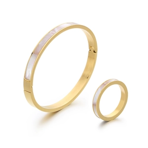 Golden stainless steel jewelry set with white shell inlay including bangle and ring