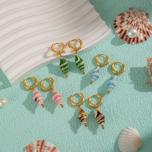 Elegant gold hoop earrings with colorful ceramic conch pendants for a beach theme look