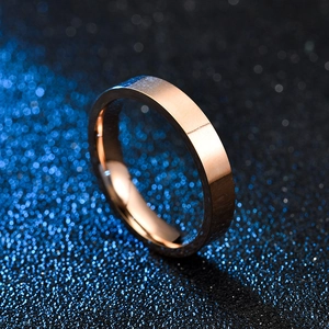 Detailed macro view of 4mm rose gold titanium ring with a brushed and polished finish