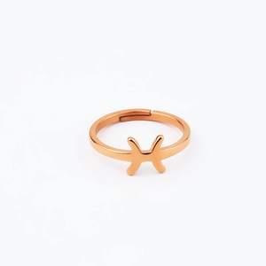 Macro view of geometric double-arc cross design on a rose gold open ring