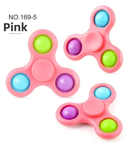 Detailed view of pink three-arm fidget spinner with colorful silicone push bubbles