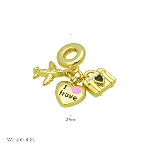 Detail view of gold-plated airplane and suitcase charms with 27mm height and 4.2g weight
