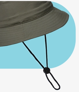 Detail of adjustable windproof drawstring with spring buckle on olive sun hat