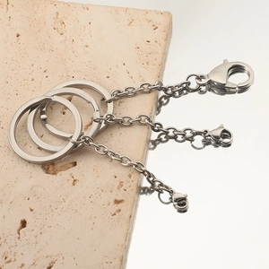 Polished stainless steel 30mm key ring with chain and lobster clasp on marble surface