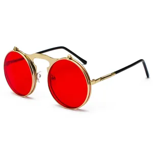 Retro steampunk round flip-up sunglasses with red lenses and textured gold metal frames