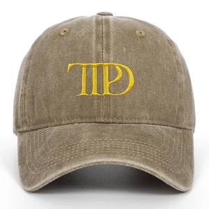 Detailed embroidery on vintage brown washed cotton baseball cap with curved brim