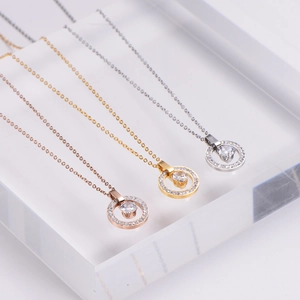 Three-color double ring pendant necklaces with round zirconia on acrylic stand