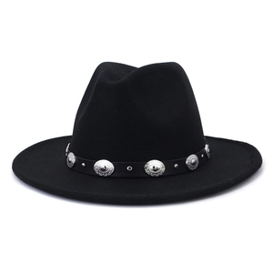 Detail of black wool fedora hat featuring a vintage leather band with silver metal studs
