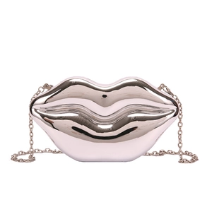 Silver metallic lip-shaped evening clutch bag with high-gloss mirror finish and chain strap