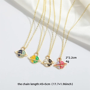 Saturn planet pendant necklaces in gold finish with rhinestones and colorful enamel detail