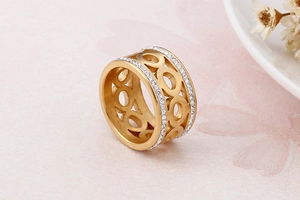 Close-up of golden hollow link ring with double rows of sparkling pave set crystals