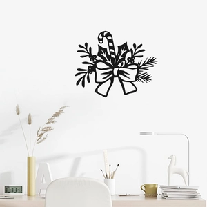 Christmas wall decal with black candy canes and bows set above a modern desk