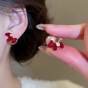 Elegant red flocked poodle earrings with large pearl backings and gold-tone finish