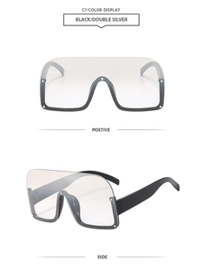 Front and side view of chic half-frame wrap-around sunglasses in black and double silver