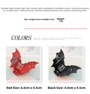 Close-up of gothic bat-shaped acetate hair claw in red and black colors with size details