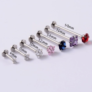 Stainless steel labret studs with zircon gems in lengths from 6mm to 19mm on white background
