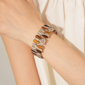 Detail of vintage teardrop bracelet with amber stones and shiny crystal embellishments
