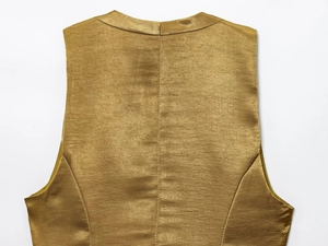 Detailed macro view of the gold satin vest back featuring rich horizontal fabric textures