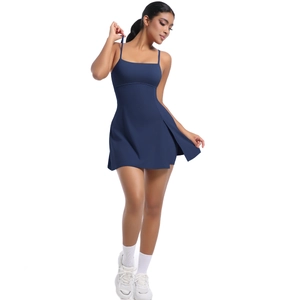 Sporty navy tennis dress with thin straps and side slit hem shown on a model