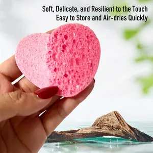 Soft pink heart-shaped cellulose facial sponge for gentle cleansing and makeup removal