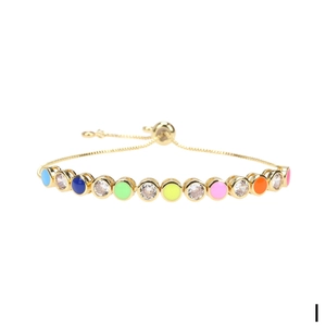 Detailed view of adjustable gold snake chain with colorful enamel evil eye charms
