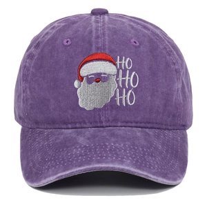 Detail of Santa Claus embroidery and HO HO HO text on purple washed cotton baseball cap