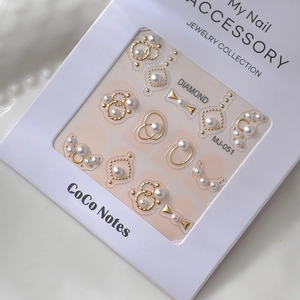 Minimalist pearl and gold metal nail art decals featuring ring and bow designs