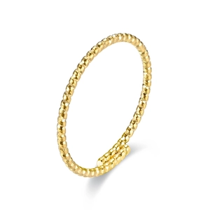 Macro shot of gold twisted spiral texture on adjustable titanium steel ring band