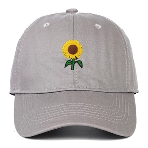 Close-up of a yellow sunflower embroidery on a premium grey cotton baseball cap