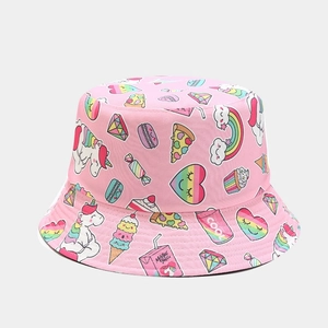 Detailed view of pink cotton bucket hat with colorful unicorn and rainbow cartoon prints