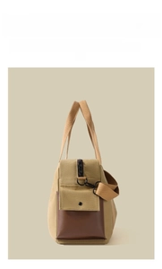 Detail view of the retro khaki canvas tote bag with brown leather accents and side pocket