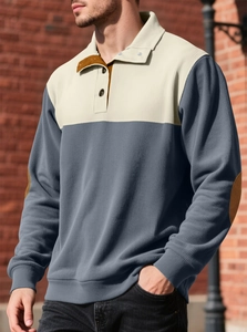 Detail of men's polo sweatshirt featuring beige and charcoal panels with elbow patches