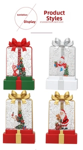 Detailed views of four festive snow globe gift box lanterns with glitter and Santa motifs