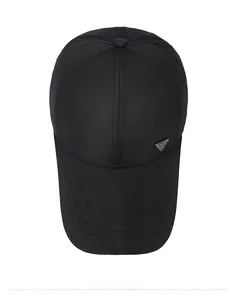 Top view of a black baseball cap with breathable mesh texture and triangle sport metal badge