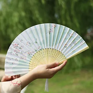 Classic Chinese folding fan with pink cherry blossoms, bamboo ribs and white silk tassel