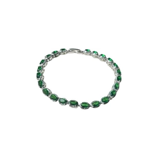 Elegant silver bracelet featuring oval green zircon stones in a vintage luxury design