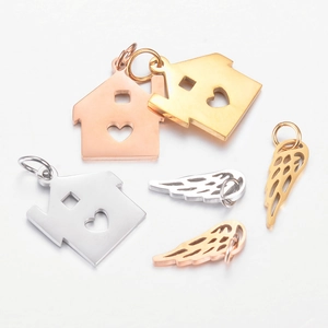 Polished stainless steel house and wing pendants in gold, rose gold, and silver finishes
