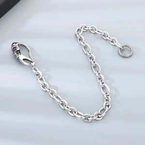 Detail of punk stainless steel skull head belt chain with polished 3:1 round O-links