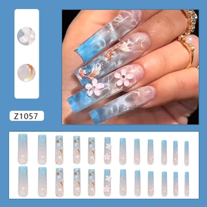 Blue gradient coffin press-on nails with koi and floral art in a full set box