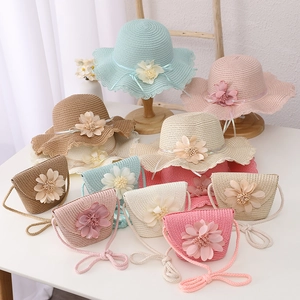 Close-up of woven straw hat set with colorful floral accents for summer sun protection