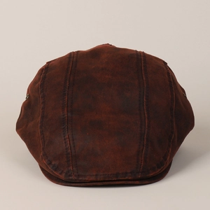Top view of brown vintage ivy cap showing matte leather texture and stitched panels