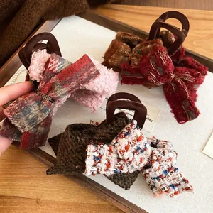 Elegant set of four tweed and flocking bow hair claws in retro autumn-winter colors