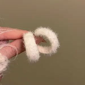 Chic white fuzzy faux fur hoop earrings with a square hollow design for elegant women