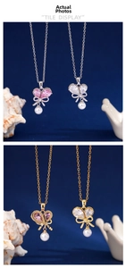 Detail of bow-shaped necklaces with zircon butterfly wings and dangling white pearls