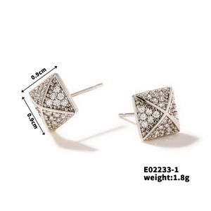 Detailed close-up of square pyramid stud earrings with cubic zirconia and 0.9cm dimensions
