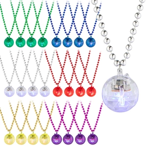 Close-up of glowing multi-color disco ball pendant necklaces with bright internal LEDs