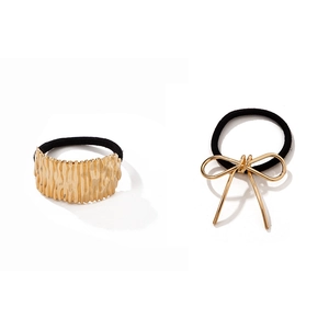 Set of two gold alloy hair ties featuring irregular ripple and bow knot designs
